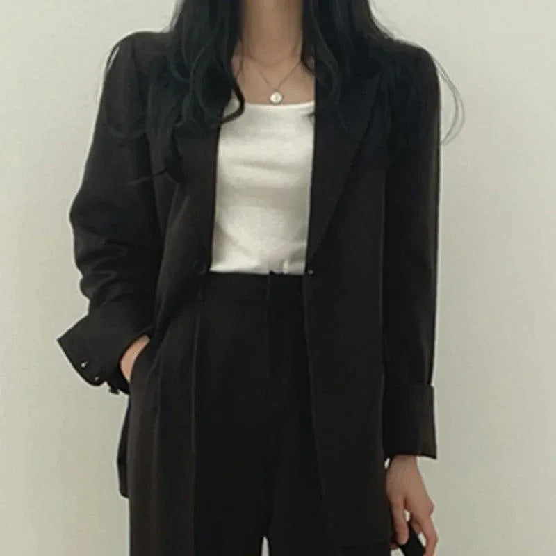 Kvinders Jakkesæt med Oversize Blazer og Højtaljede Bukser 10